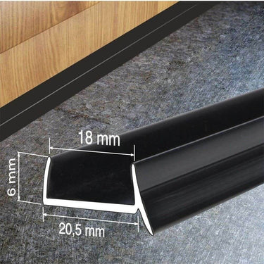 Black PVC plinth sealing strip installed on a kitchen kickboard, with dimensions 20.5mm x 18mm x 6mm for moisture and dirt protection.