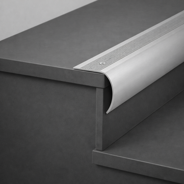 Aluminium stair nosing bullnose edge trim installed on tiled staircase step